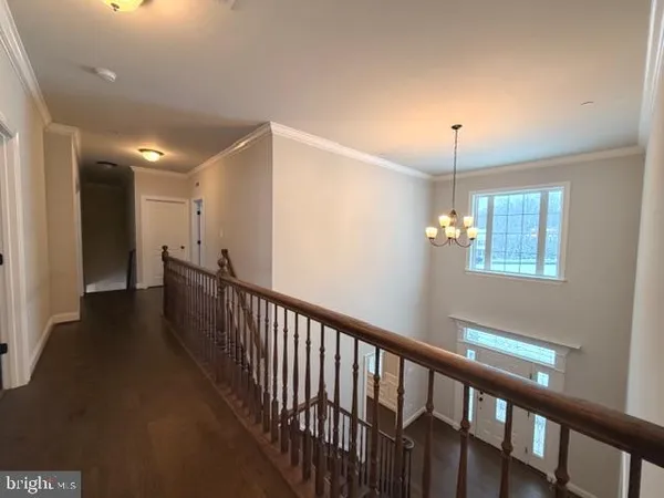 a view of a hallway with windows