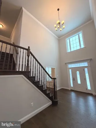 a view of livingroom with floor to ceiling windows