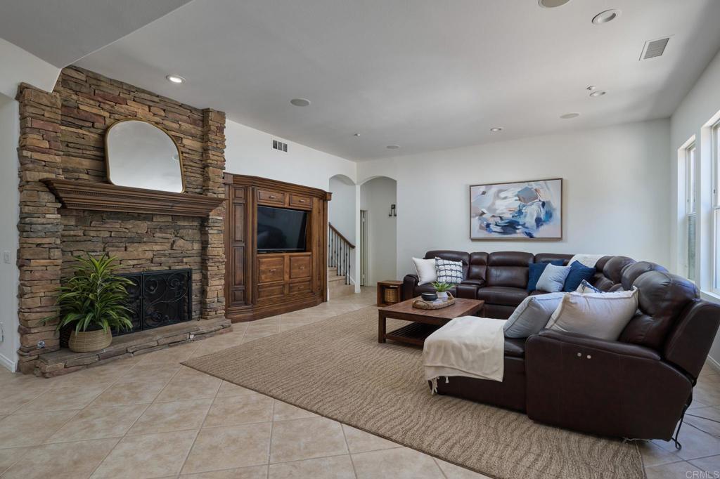 835 Stratford Knoll Encinitas, CA 92024 - Photo 15 of 31 a living room with furniture and a fireplace