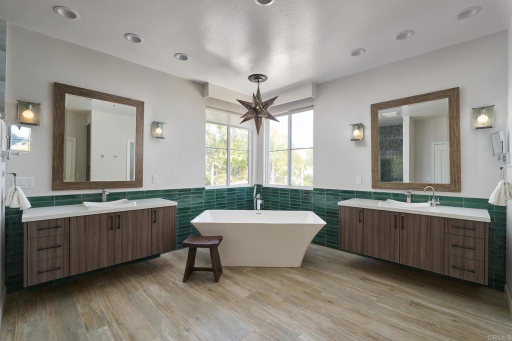 835 Stratford Knoll Encinitas, CA 92024 - Photo 19 of 31 a bathroom with a double vanity sink mirror and bathtub