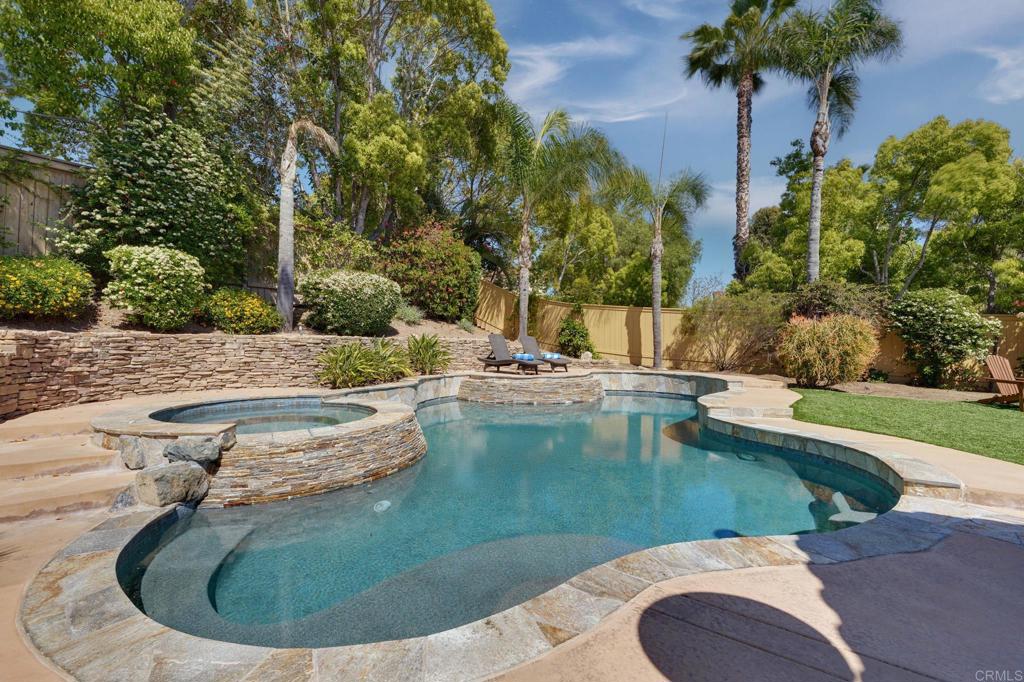 835 Stratford Knoll Encinitas, CA 92024 - Photo 2 of 31 a view of a swimming pool with a yard