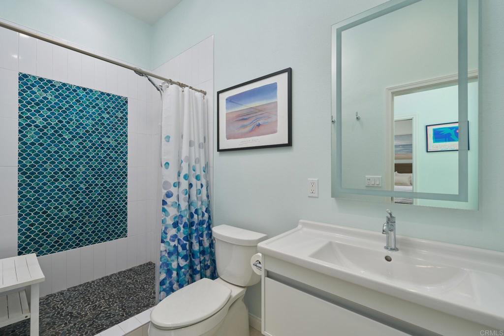835 Stratford Knoll Encinitas, CA 92024 - Photo 26 of 31 a bathroom with a sink a toilet and shower