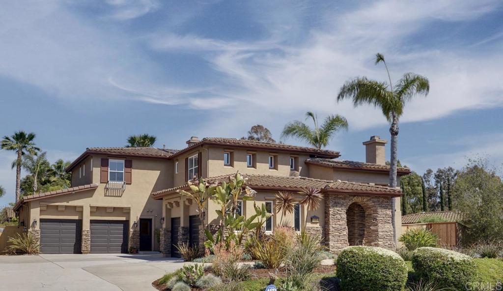 835 Stratford Knoll Encinitas, CA 92024 - Photo 27 of 31 a front view of a house with a yard and potted plants