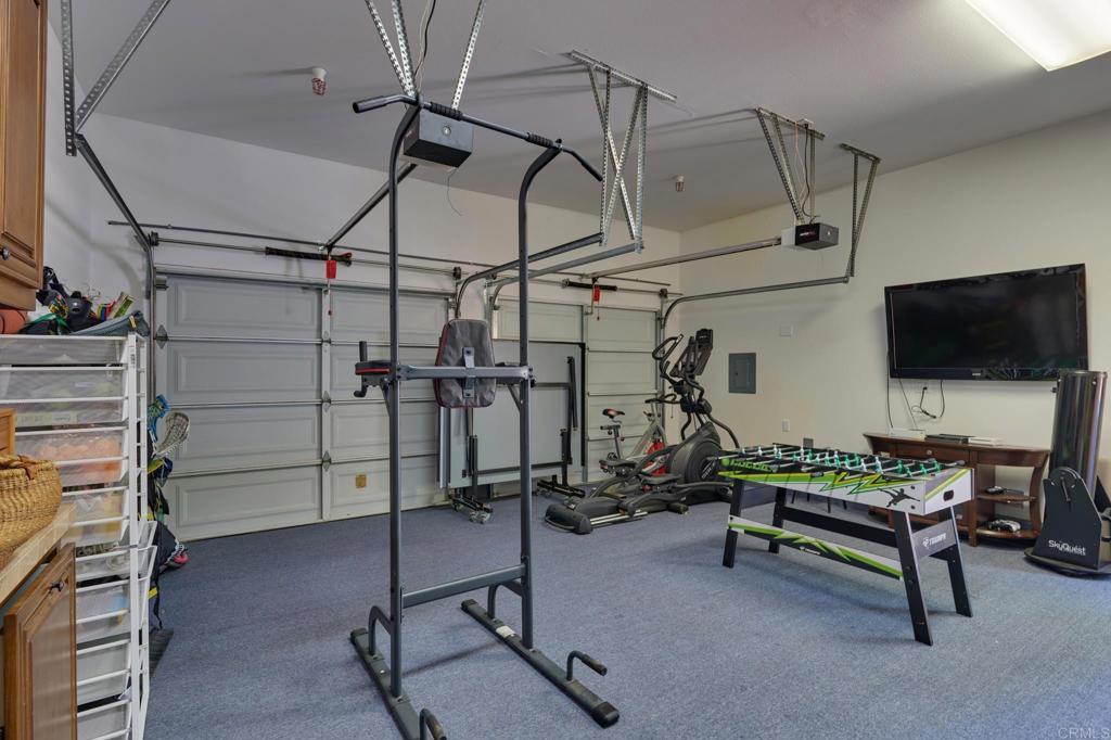 835 Stratford Knoll Encinitas, CA 92024 - Photo 28 of 31 a view of a room with gym equipment