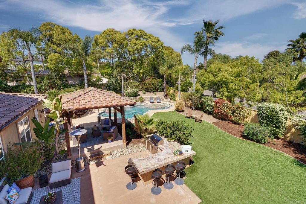 835 Stratford Knoll Encinitas, CA 92024 - Photo 3 of 31 a view of a backyard with plants and patio