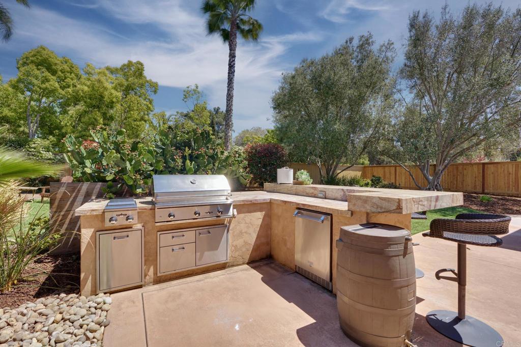 835 Stratford Knoll Encinitas, CA 92024 - Photo 7 of 31 a view of a kitchen with a stove