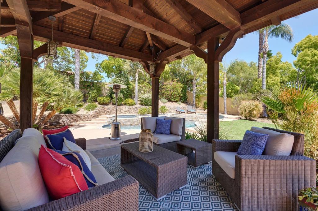 835 Stratford Knoll Encinitas, CA 92024 - Photo 9 of 31 a outdoor living area with furniture and a garden