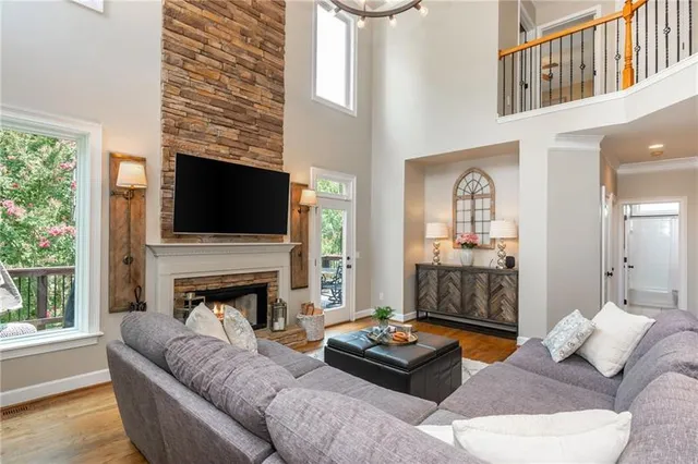 a view of a chairs and table in the back yard of the house