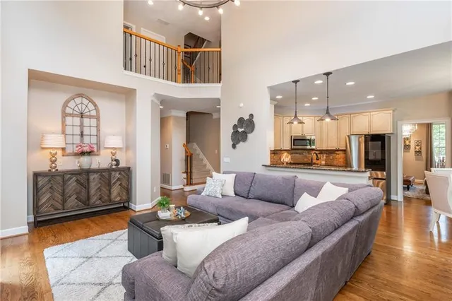 a bedroom with a bed couch and dresser