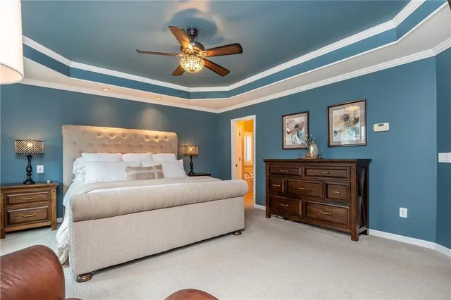 a en suite bathroom with a sink a mirror and a shower