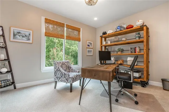 a living room with furniture a flat screen tv and a couch