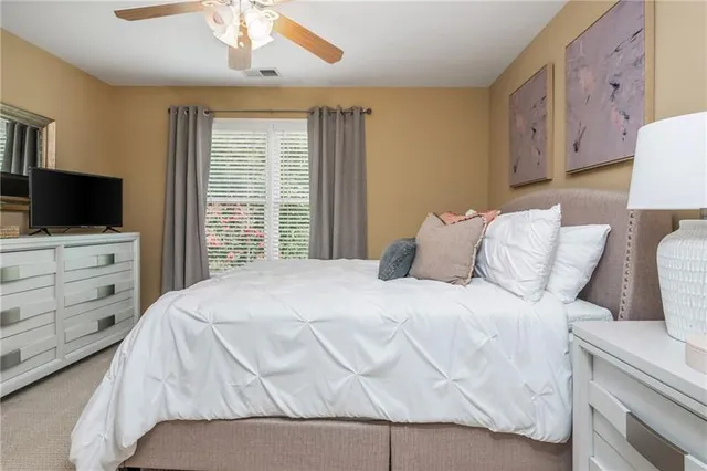 a bathroom with a sink toilet and mirror