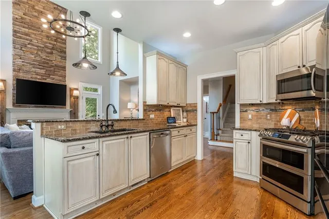 a living room with furniture and a large mirror