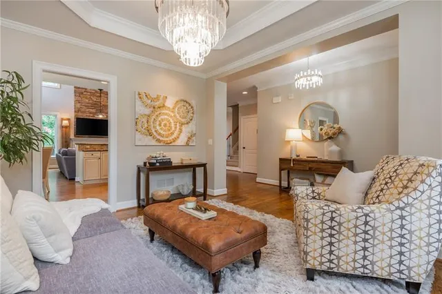 a kitchen with granite countertop a refrigerator and a stove top oven