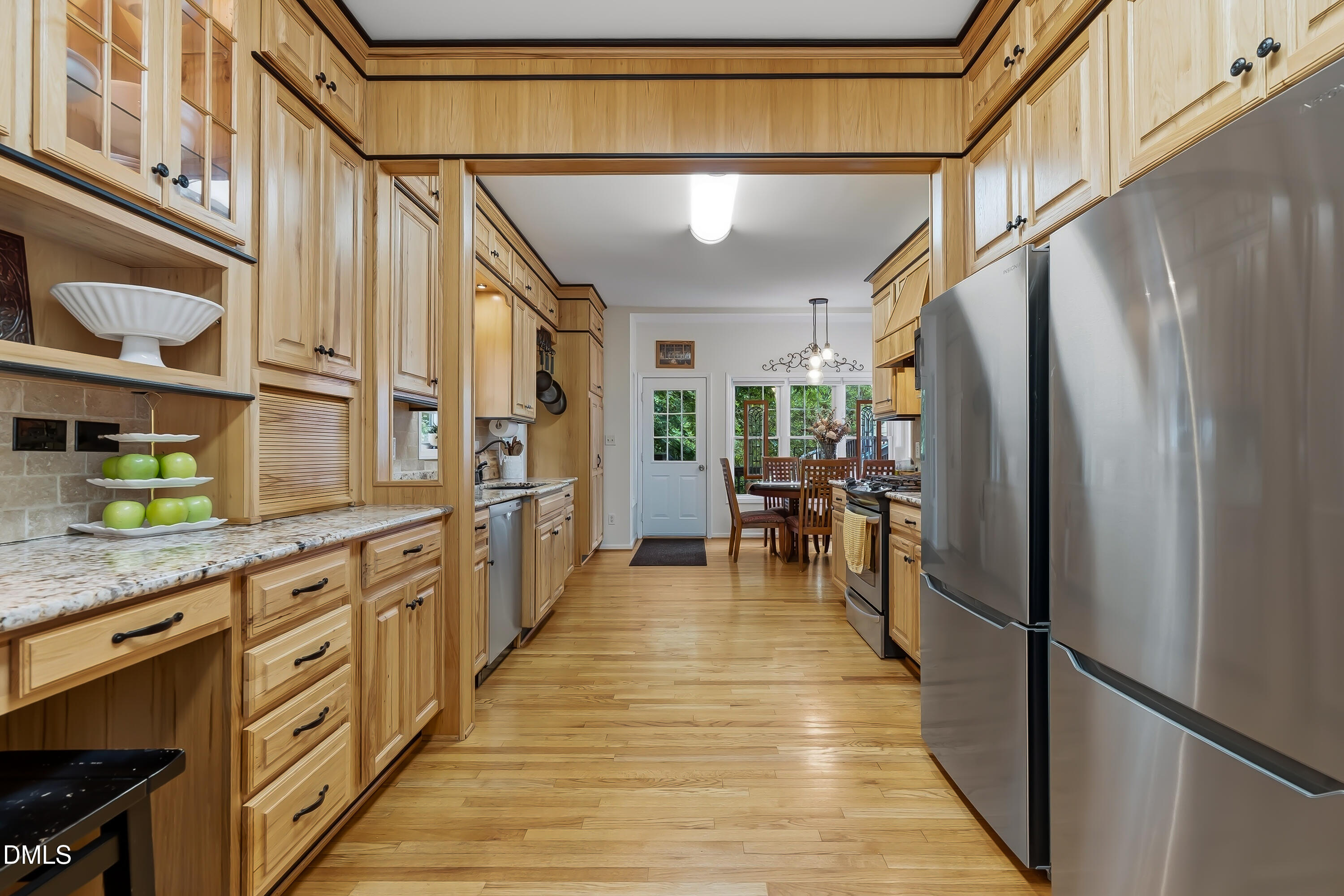1214 Halcyon Place Rougemont, NC 27572 - Photo 22 of 69 a kitchen with stainless steel appliances granite countertop a refrigerator and a stove