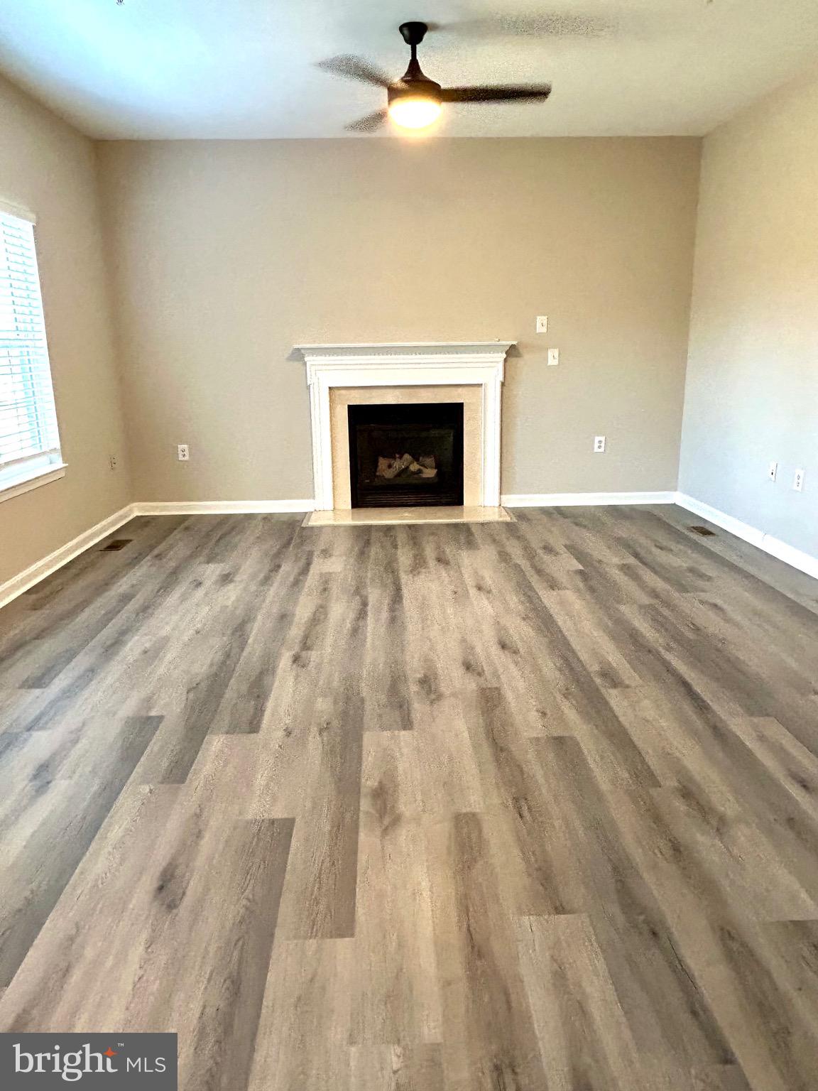 12003 Piscataway Road Clinton, MD 20735 - Photo 12 of 68 a view of empty room with a fireplace
