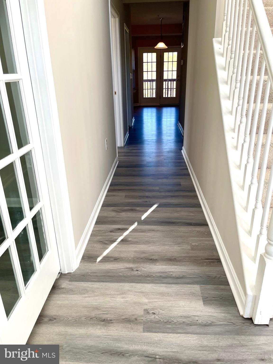 12003 Piscataway Road Clinton, MD 20735 - Photo 3 of 68 a view of entryway and hall with wooden floor