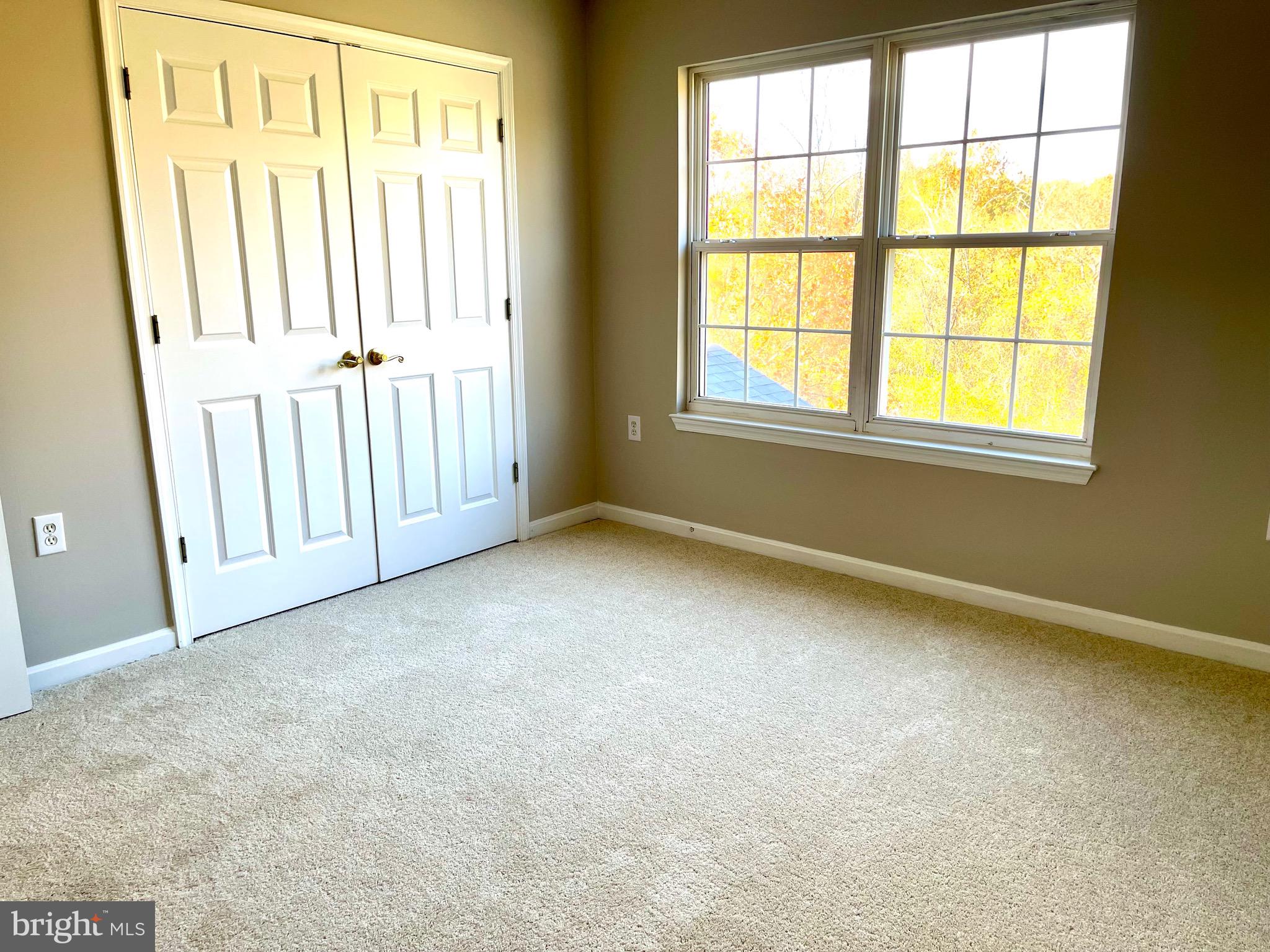 12003 Piscataway Road Clinton, MD 20735 - Photo 32 of 68 an empty room with windows