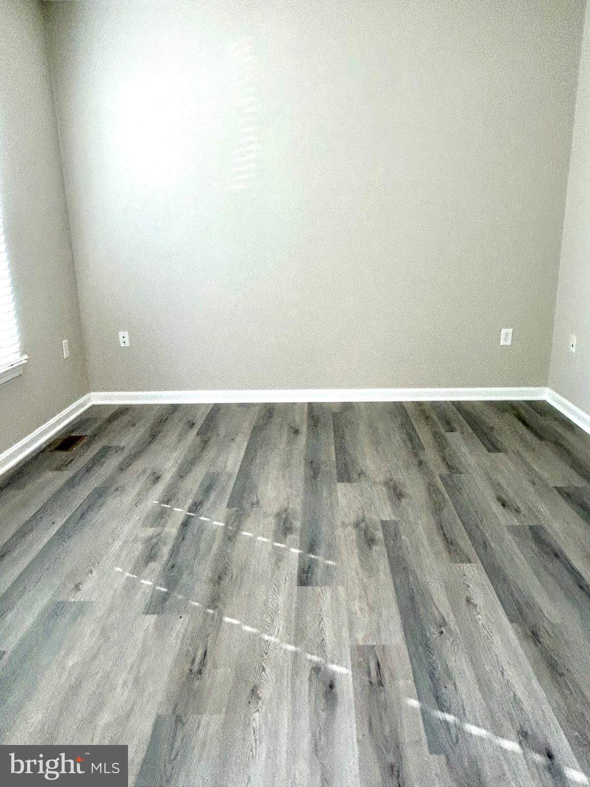 12003 Piscataway Road Clinton, MD 20735 - Photo 40 of 68 an empty room with wooden floor