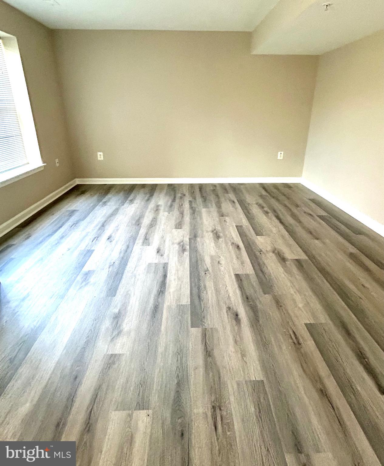12003 Piscataway Road Clinton, MD 20735 - Photo 47 of 68 a view of wooden floor and brick walls