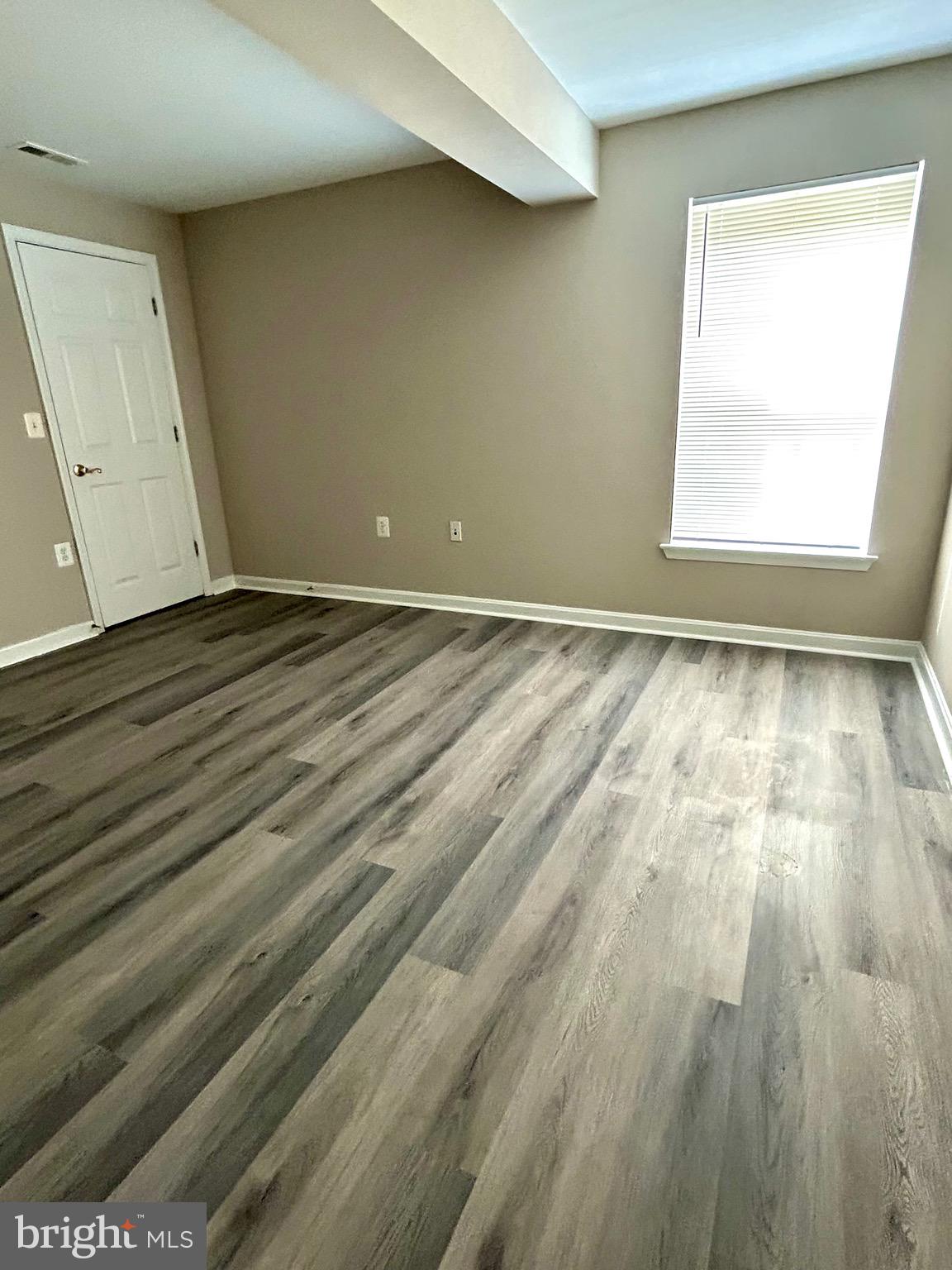 12003 Piscataway Road Clinton, MD 20735 - Photo 48 of 68 a view of an empty room and wooden floor