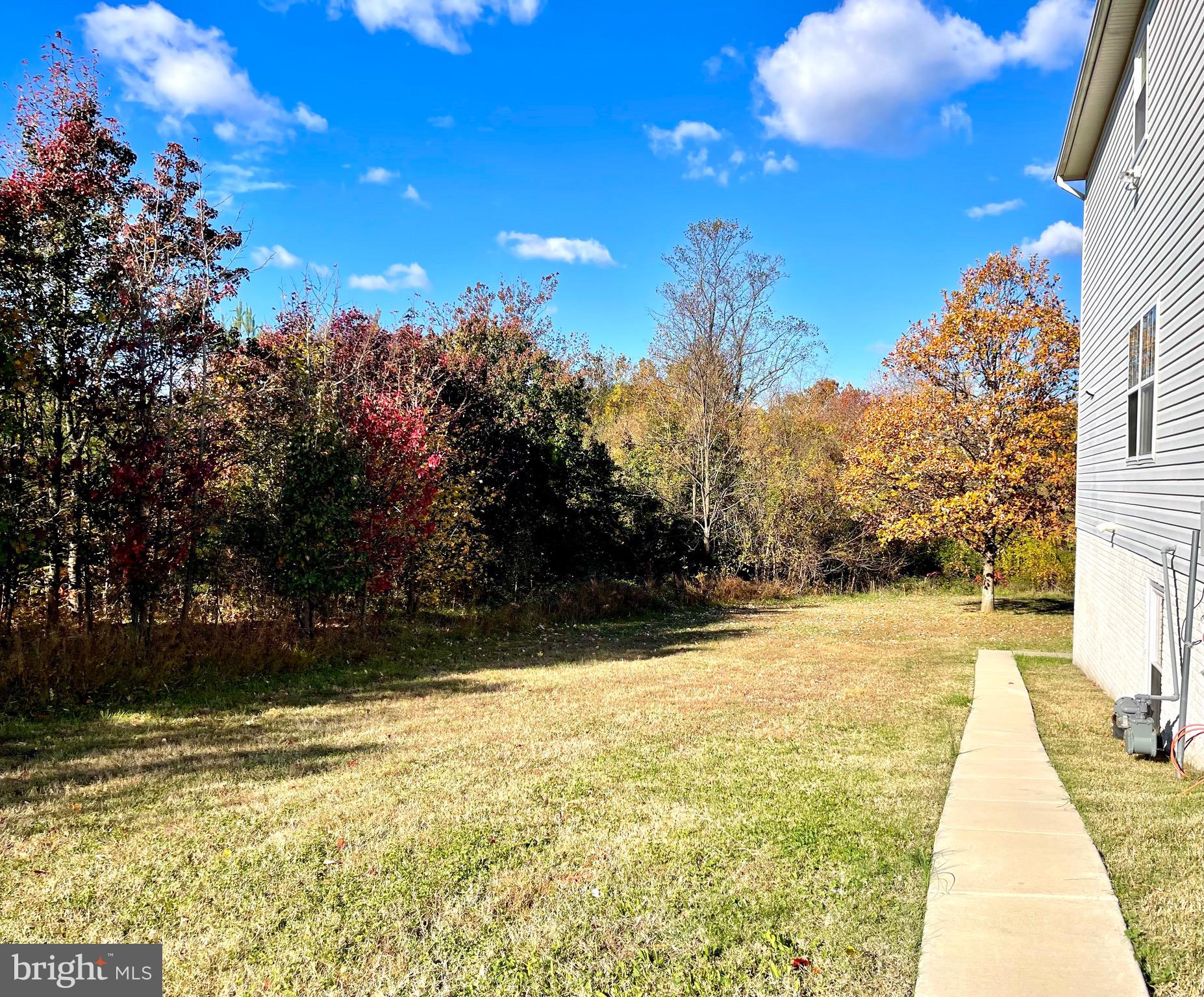 12003 Piscataway Road Clinton, MD 20735 - Photo 56 of 68 a view of swimming pool with seating area and trees in the background