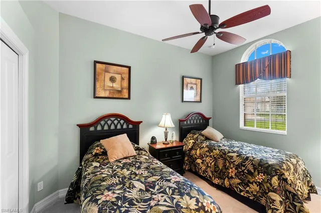 a bedroom with bed and a window