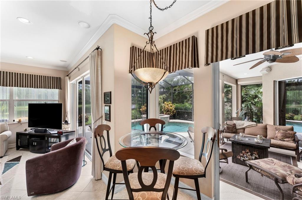 6155 Dogleg Drive Naples, FL 34113 - Photo 25 of 36 a view of a dining room with furniture window and outside view