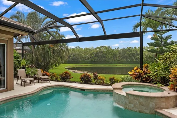 a view of a swimming pool with a patio