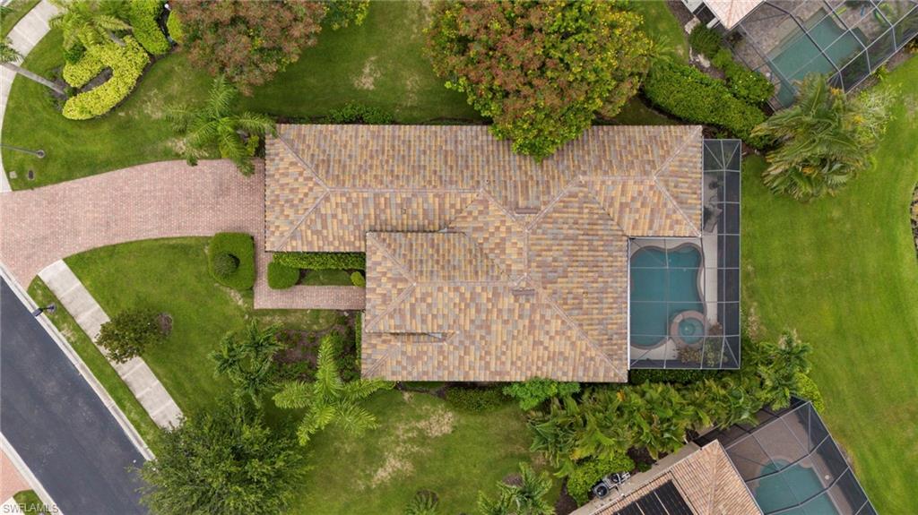 6155 Dogleg Drive Naples, FL 34113 - Photo 32 of 36 a view of a garden with plants