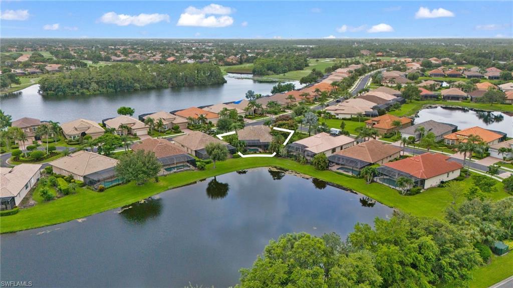 6155 Dogleg Drive Naples, FL 34113 - Photo 35 of 36 an aerial view of a house with a lake view
