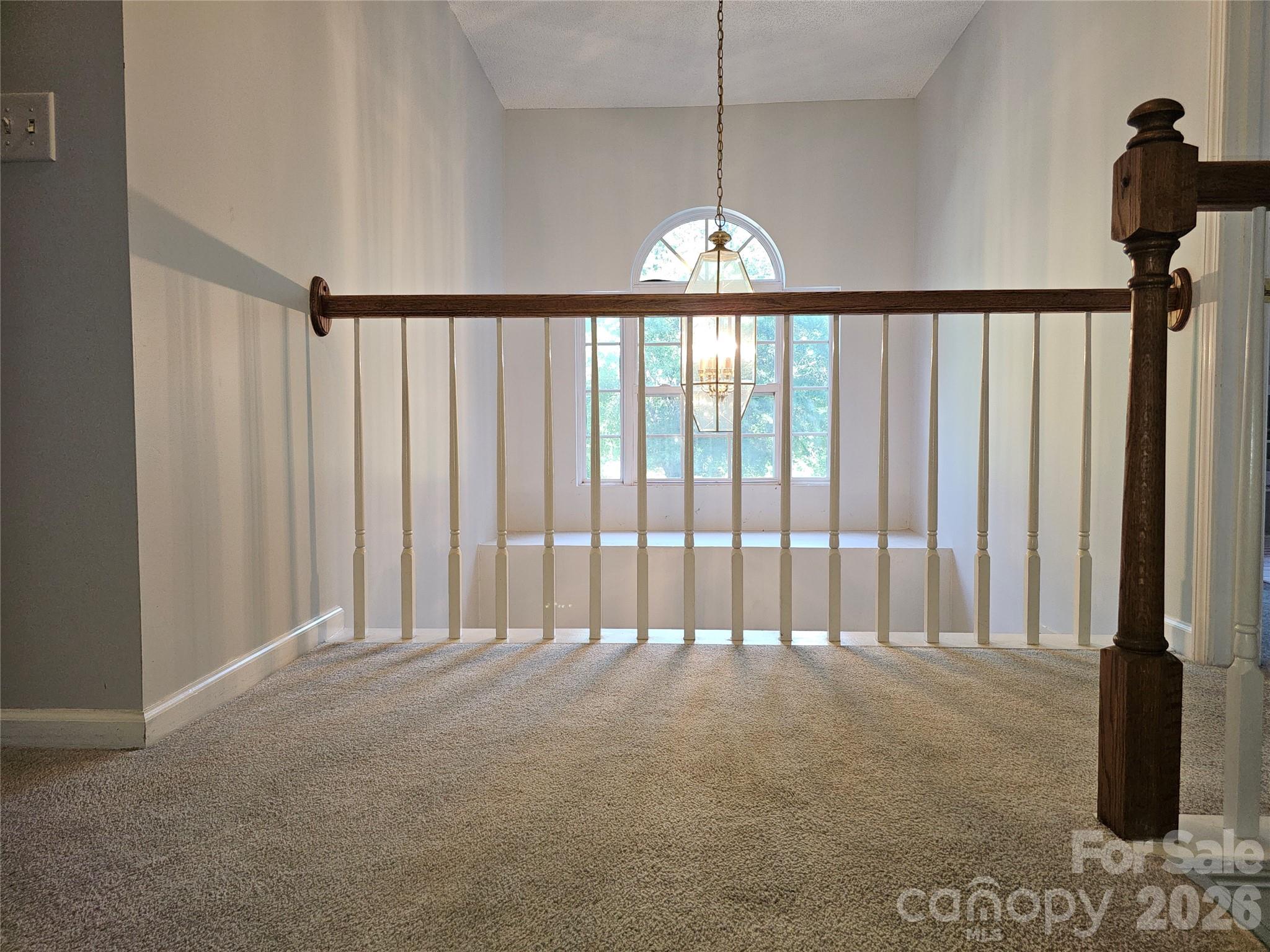 815 Knightsbridge Road Fort Mill, SC 29708 - Photo 21 of 30 a view of staircase with railing and chandelier