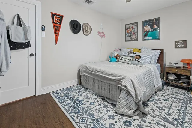 a bedroom with a bed and a table in it