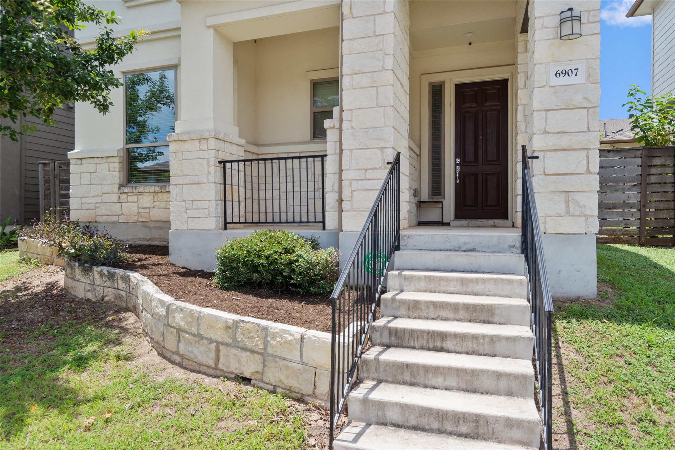 6907 Idea Road Austin, TX 78741 - Photo 3 of 36 a view of a house with couches and potted plants