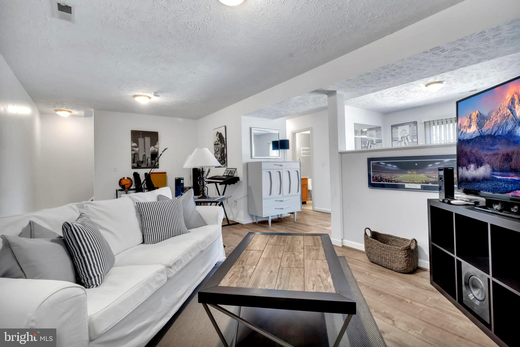 415 Beach Drive Annapolis, MD 21403 - Photo 38 of 54 Trendy LVP Flooring . Home Theater Area