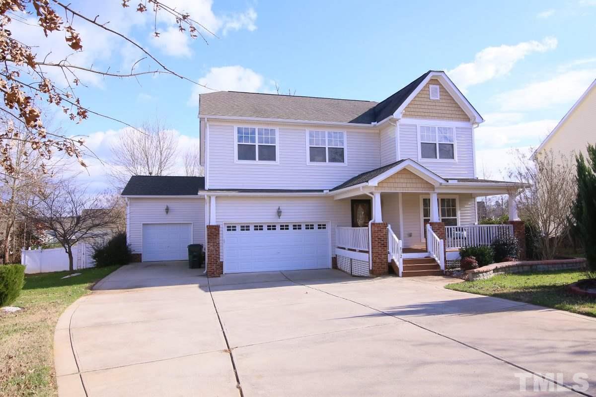 832 Seastone Street Raleigh, NC 27603 - Photo 1 of 25 a front view of a house with a yard