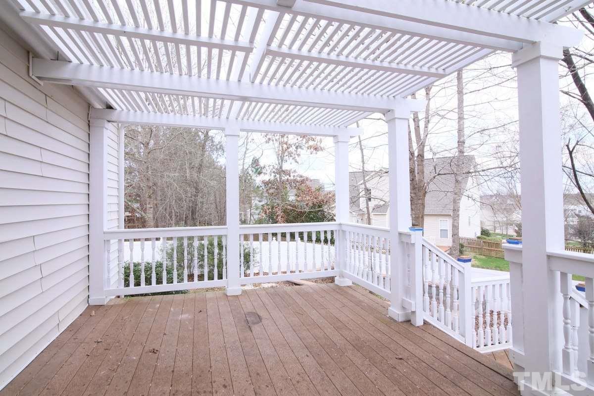 832 Seastone Street Raleigh, NC 27603 - Photo 11 of 25 a view of a porch with wooden floor