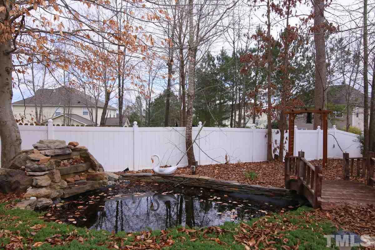 832 Seastone Street Raleigh, NC 27603 - Photo 13 of 25 a view of a backyard of the house