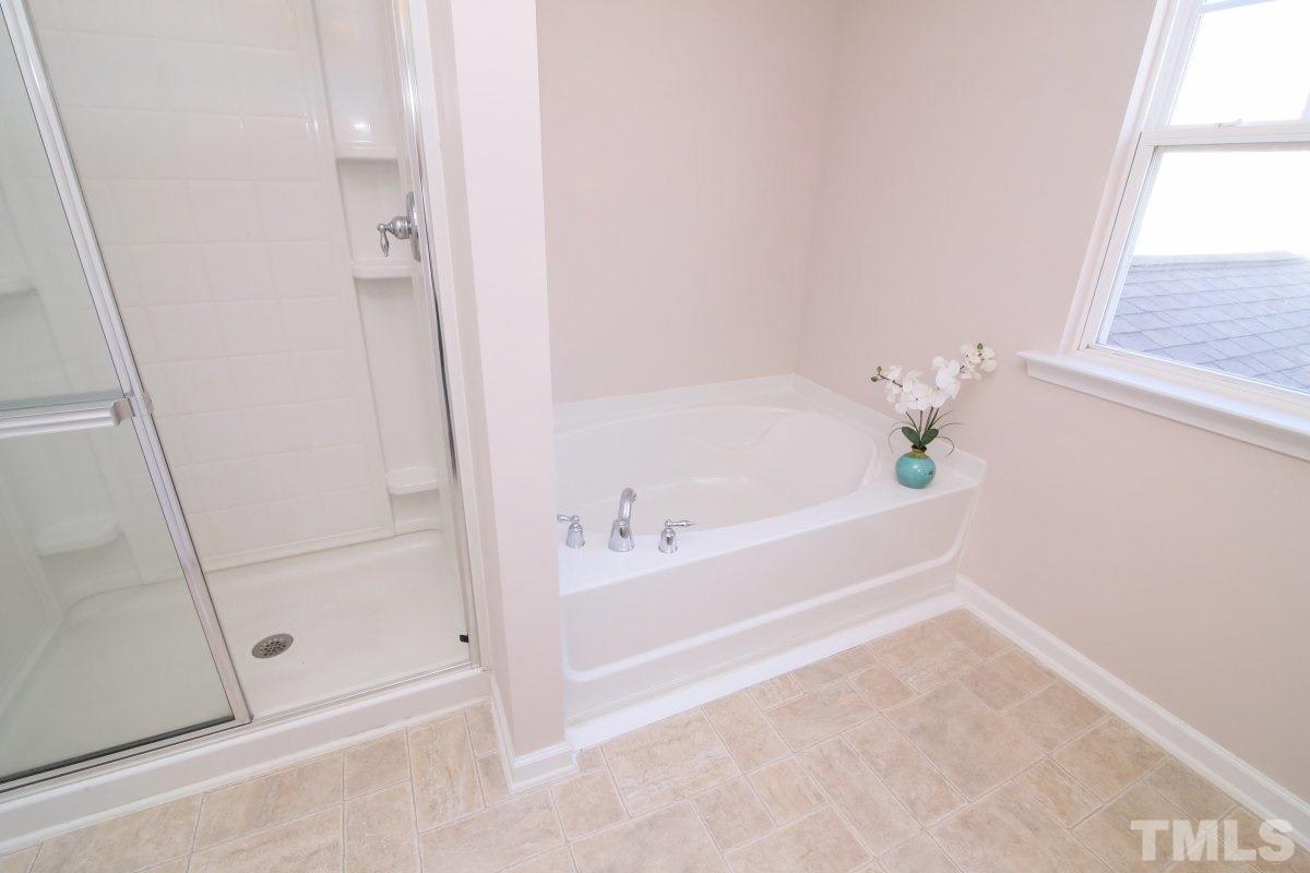 832 Seastone Street Raleigh, NC 27603 - Photo 17 of 25 a bathroom with a bathtub