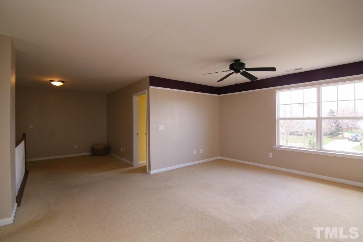 832 Seastone Street Raleigh, NC 27603 - Photo 18 of 25 a view of an empty room with a window