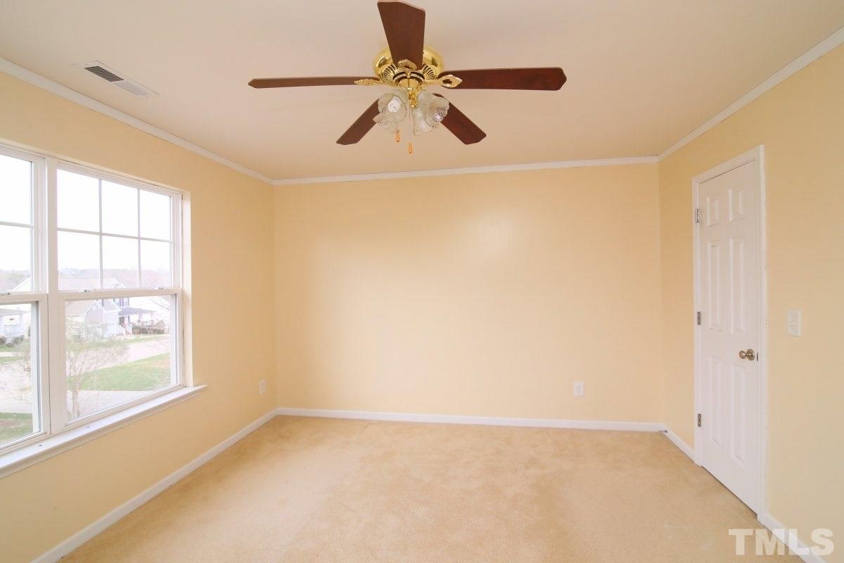 832 Seastone Street Raleigh, NC 27603 - Photo 19 of 25 a view of an empty room with a window