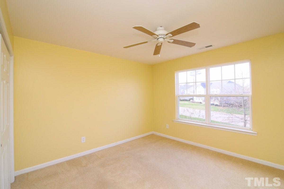 832 Seastone Street Raleigh, NC 27603 - Photo 20 of 25 a view of an empty room with a window