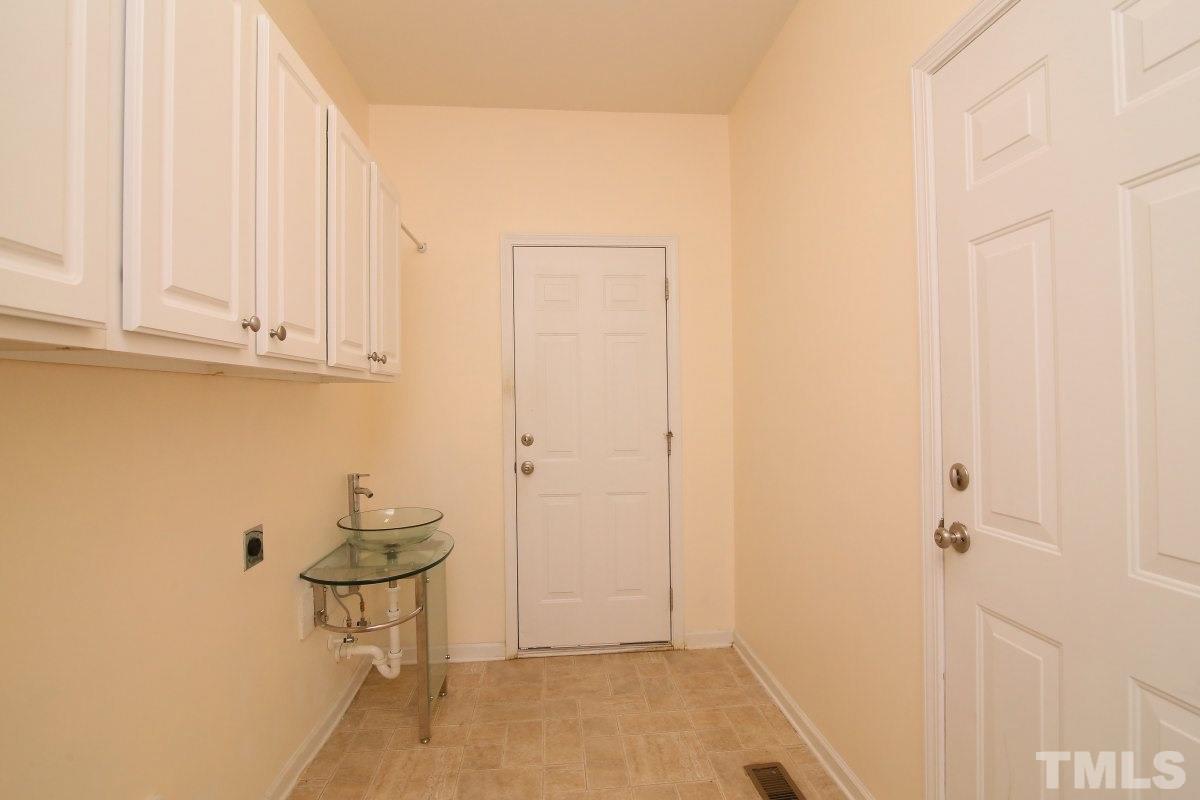 832 Seastone Street Raleigh, NC 27603 - Photo 22 of 25 a view of room with table and chair