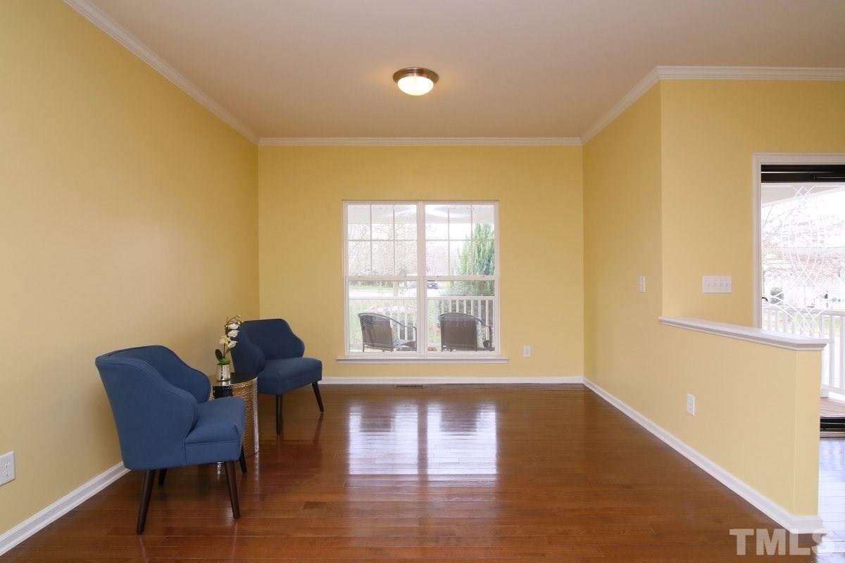 832 Seastone Street Raleigh, NC 27603 - Photo 7 of 25 a view of a workspace with furniture and a window