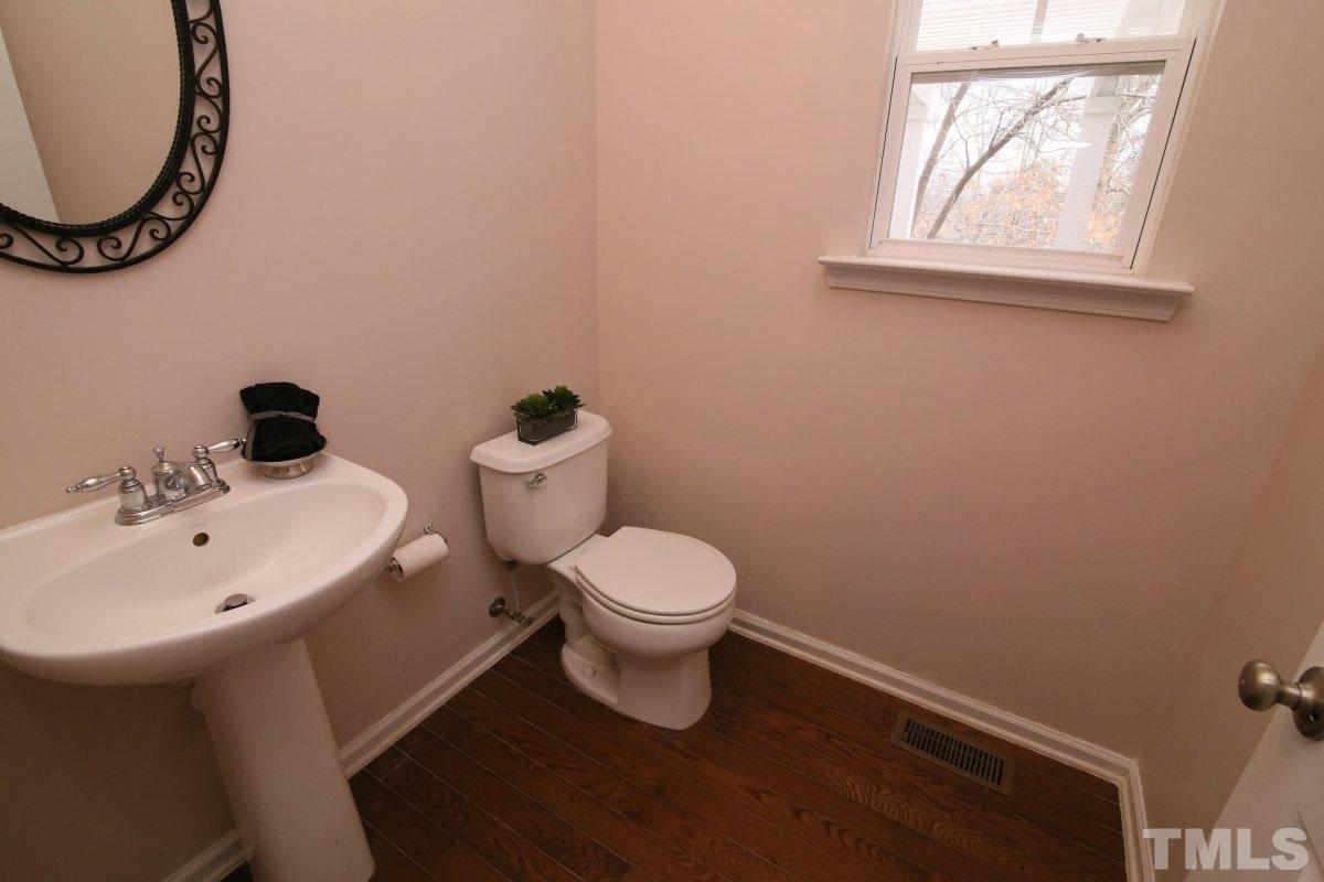 832 Seastone Street Raleigh, NC 27603 - Photo 8 of 25 a bathroom with a sink and a mirror