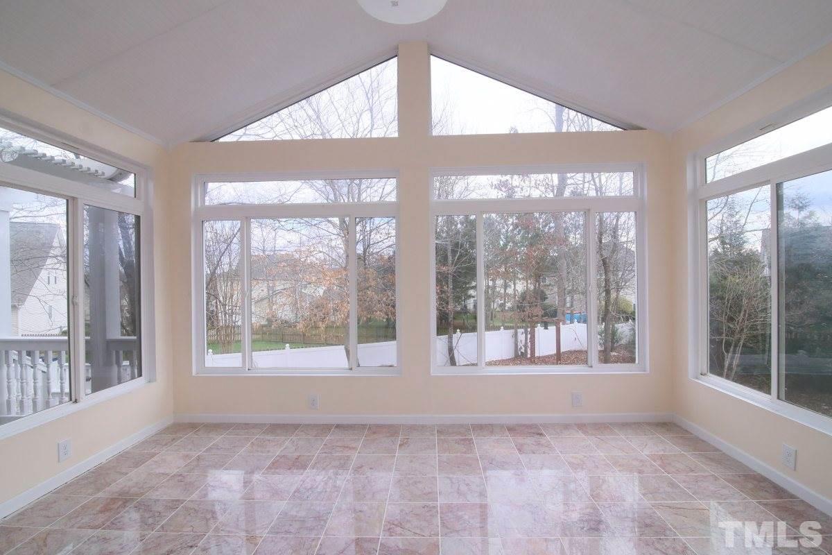 832 Seastone Street Raleigh, NC 27603 - Photo 9 of 25 a view of an empty room with a large window