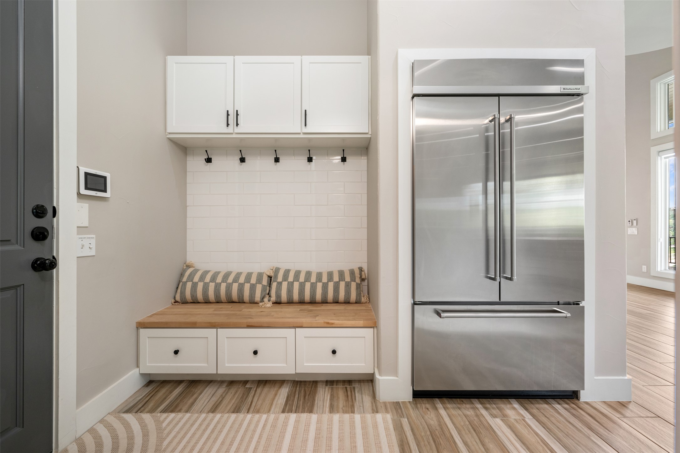 10716 Beach Road Leander, TX 78641 - Photo 11 of 39 Mudroom featuring baseboards and light wood finished floors