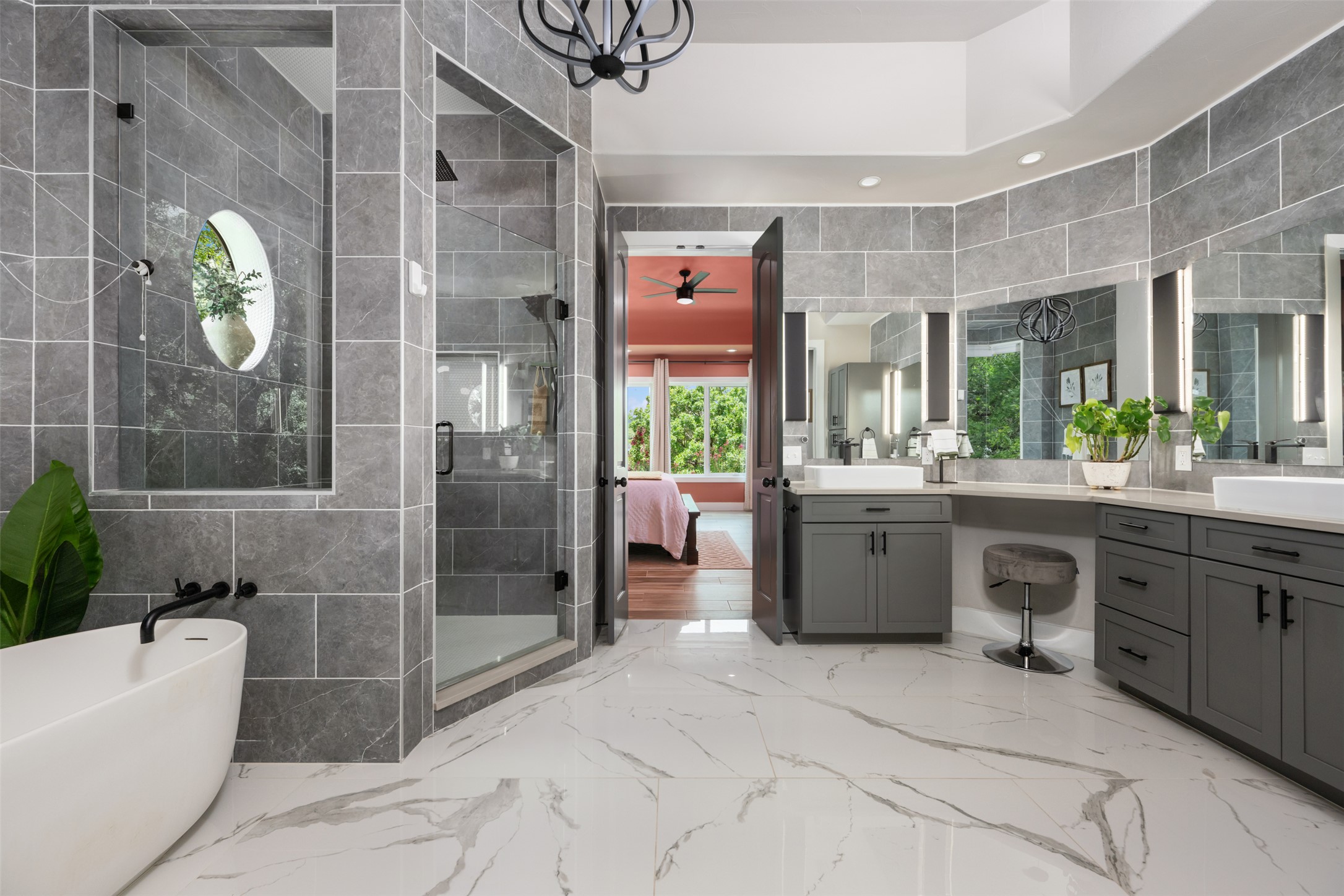 10716 Beach Road Leander, TX 78641 - Photo 16 of 39 Bathroom featuring vanity, a stall shower, a freestanding tub, recessed lighting, and marble tiled floors