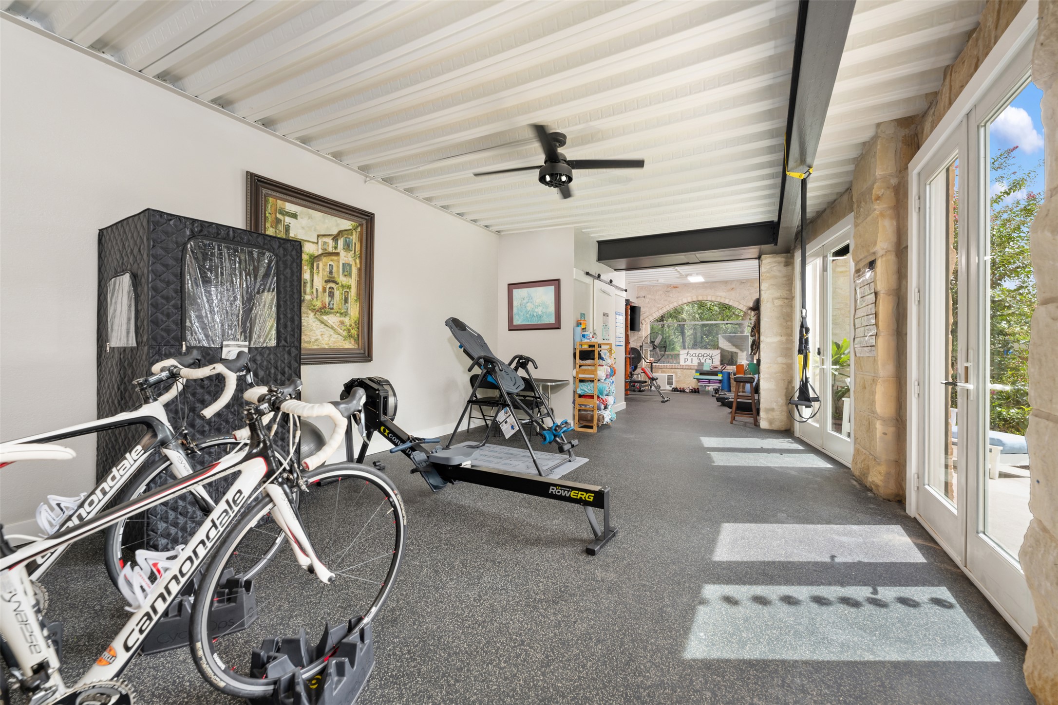 10716 Beach Road Leander, TX 78641 - Photo 19 of 39 Workout area featuring a ceiling fan and french doors