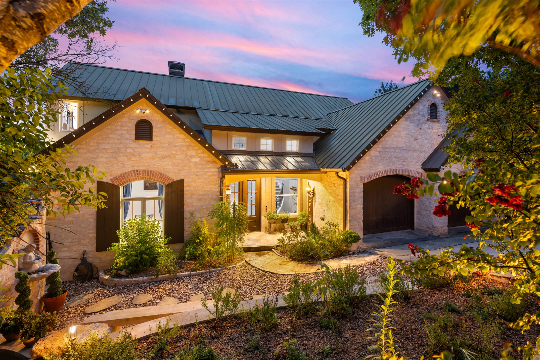10716 Beach Road Leander, TX 78641 - Photo 2 of 39 View of front of home featuring french doors, a standing seam roof, a metal roof, a garage, and a chimney